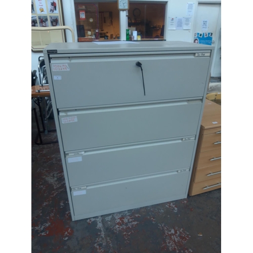 22 - A TRIUMPH GREY METAL FOUR DRAWER OFFICE FILING CABINET