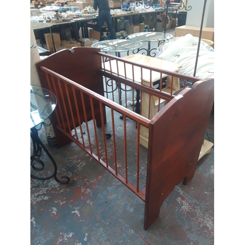 33 - A CHILD'S WOODEN COT