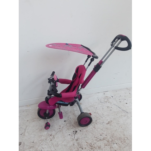 47 - A BLACK AND PINK SMART TRIKE CHILD'S TRICYCLE WITH ADULTS SAFETY HANDLE