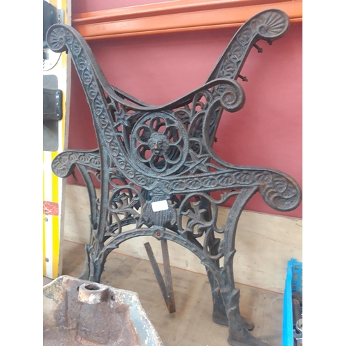 55 - A PAIR OF CAST IRON ORNATE GARDEN BENCH ENDS