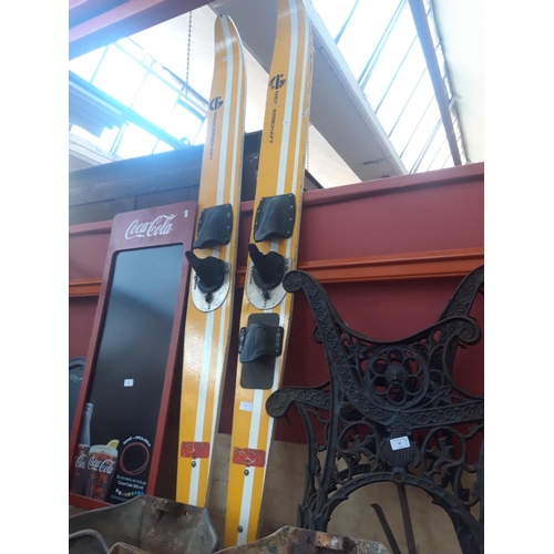 57 - A PAIR OF YELLOW AND WHITE WATER SKIS - GILCRAFT OF GREAT YARMOUTH