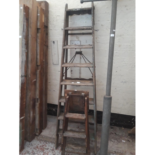 81 - TWO SETS OF VINTAGE STEP LADDERS, ONE SIMPLEX WITH CAST IRON HINGES AND ONE SMALL WOODEN STEP STOOL