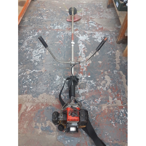 66 - A RED KAWASAKI TD40 PETROL GARDEN STRIMMER