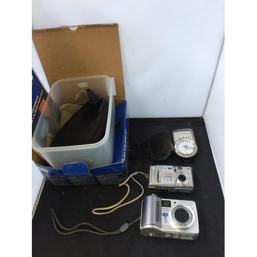 388 - A BOX CONTAINING AN OLYMPUS C-55 CAMERA, OLYMPUS 6.1 MEGAPIXEL CAMERA AND A LIGHT METER