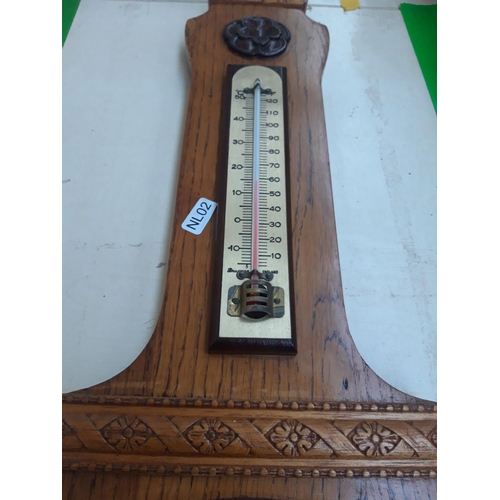 502 - A VINTAGE OAK BAROMETER