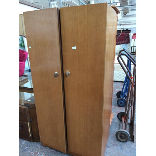 558 - A RETRO AVALON TEAK DOUBLE WARDROBE