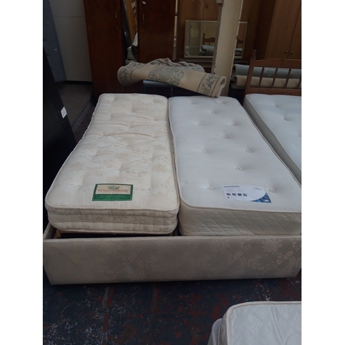 565 - A KING SIZE ELECTRIC BED BASE WITH TWO SINGLE MATTRESSES