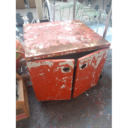 153 - A RED METAL TWO DOOR WORKSHOP STORAGE CABINET