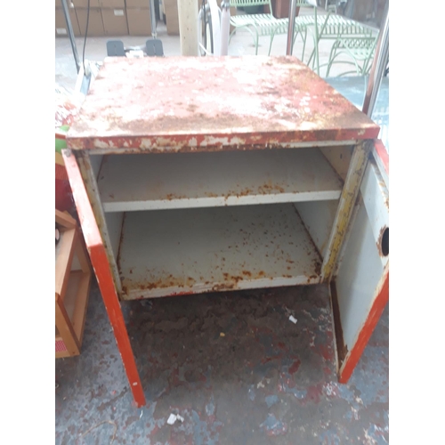 153 - A RED METAL TWO DOOR WORKSHOP STORAGE CABINET