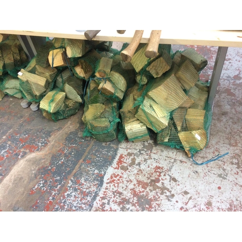 122 - TEN BAGS OF FIRE LOGS