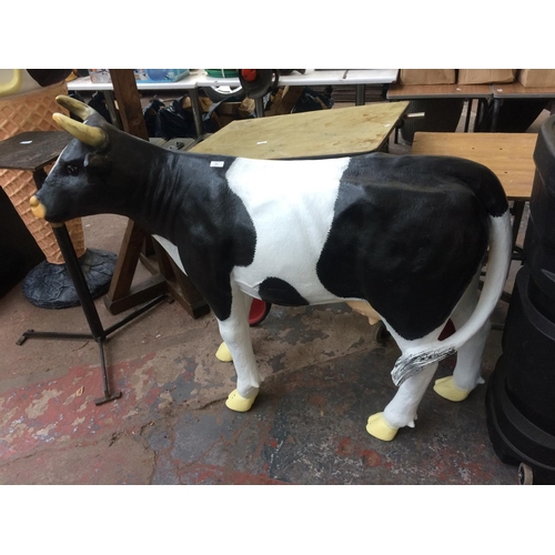 171 - A PLASTIC FRIESIAN COW GARDEN ORNAMENT