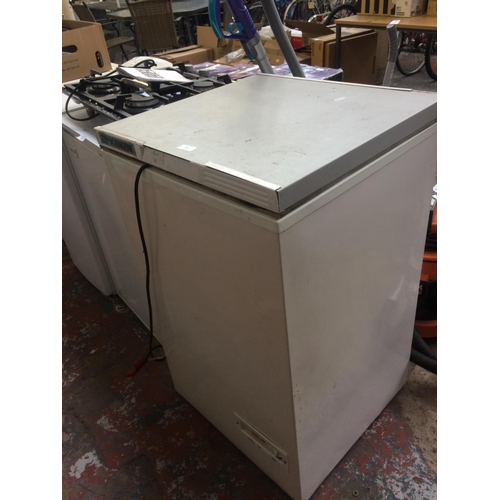 203 - A McKENZIE 58cm TOP LOADING CHEST FREEZER