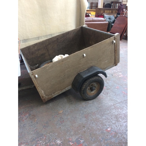 30 - A TWO WHEELED WOODEN CAR TRAILER MEASURING APPROX 4' x 3' x 18