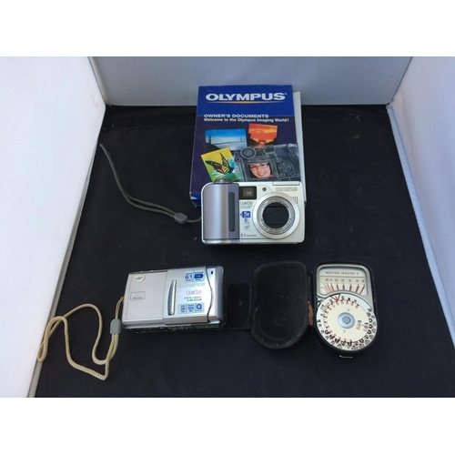 388 - A BOX CONTAINING AN OLYMPUS C-55 CAMERA, OLYMPUS 6.1 MEGAPIXEL CAMERA AND A LIGHT METER