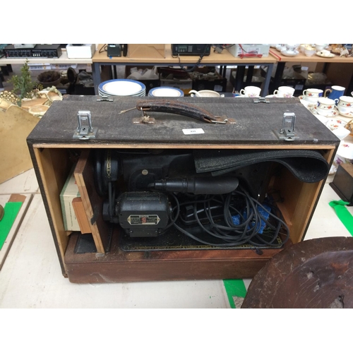 433 - A CASED VINTAGE ELECTRIC SEWING MACHINE