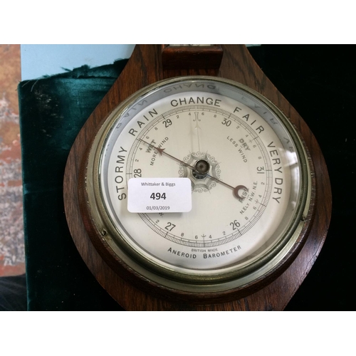 494 - A VINTAGE OAK BAROMETER