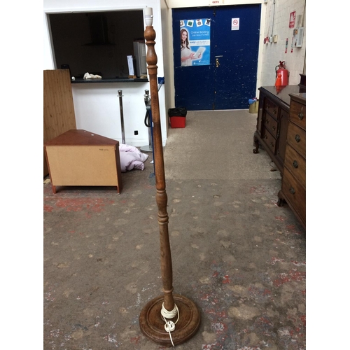 575 - AN OAK STANDARD LAMP