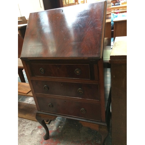 585 - A VINTAGE MAHOGANY LADIES BUREAU WITH THREE DRAWERS AND FALL FRONT ON CABRIOLE LEGS