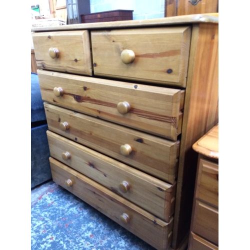 595 - A PINE CHEST OF DRAWERS WITH TWO SHORT DRAWERS OVER FOUR LONG