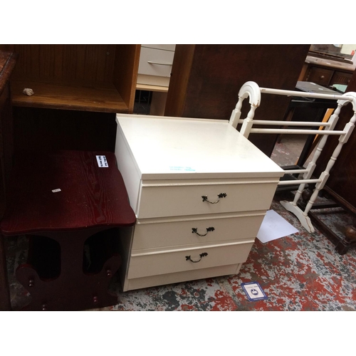 601 - THREE ITEMS: A WHITE PAINTED CLOTHES AIRER, WHITE LAMINATE CHEST OF THREE DRAWERS AND A MAHOGANY EFF... 