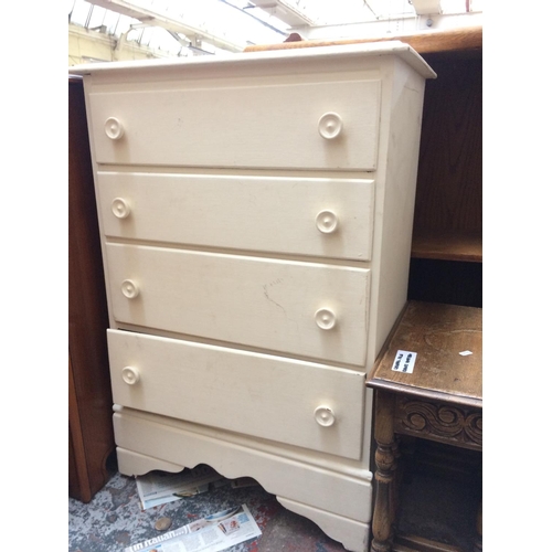 603 - A WHITE PAINTED CHEST OF FOUR DRAWERS