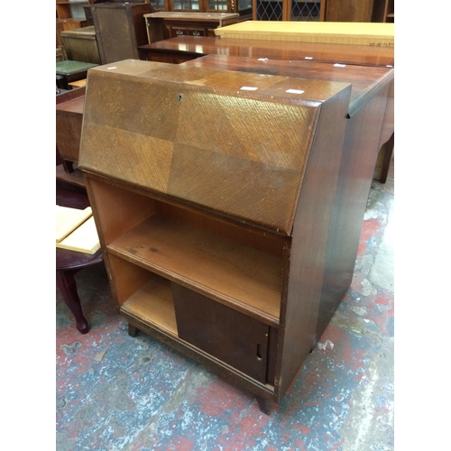 611 - AN OAK BUREAU WITH TWO SLIDING DOORS