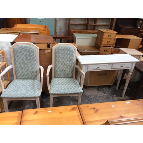 617 - A LIMED OAK HALL TABLE WITH TWO DRAWERS AND TWO MATCHING DINING CHAIRS