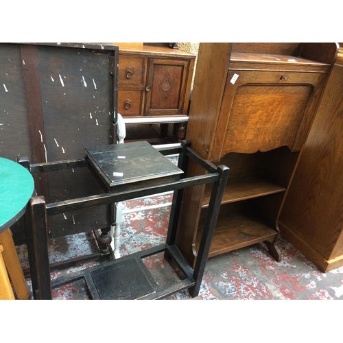 620 - TWO ITEMS: AN OAK BUREAU WITH TWO SHELVES AND FALL FRONT AND AN OAK STICK STAND