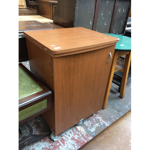 622 - A TEAK EFFECT SEWING MACHINE CABINET