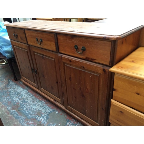 632 - A PINE SIDEBOARD WITH THREE DRAWERS AND THREE DOORS