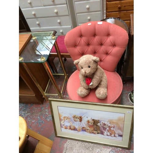 634 - FOUR ITEMS: A PINK BUTTON BACK BOUDOIR CHAIR, A GLASS AND BRASS TWO TIER OCCASIONAL TABLE, A TEDDY B... 