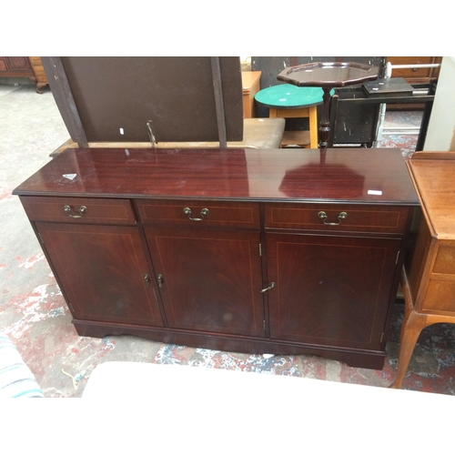 649 - A MAHOGANY SIDEBOARD WITH THREE DOORS AND THREE DRAWERS