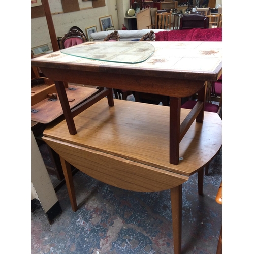 664 - TWO ITEMS: A TEAK TILE TOP COFFEE TABLE AND A MAHOGANY EFFECT DROP LEAF KITCHEN TABLE