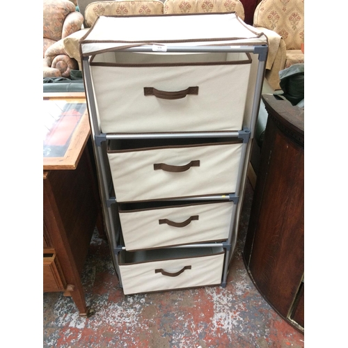 670 - A WHITE CANVAS CHEST OF FOUR DRAWERS