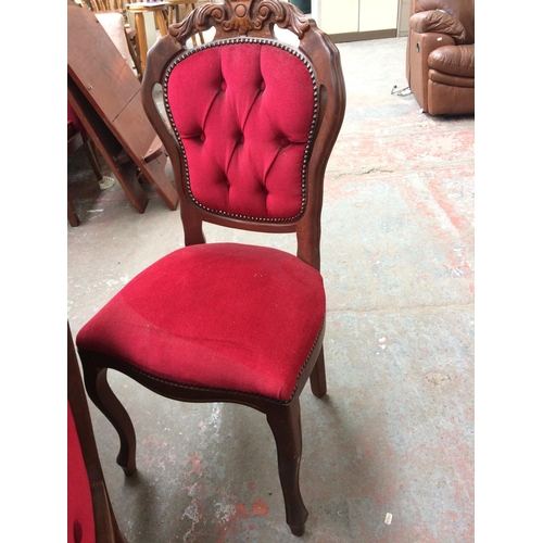 674 - A LARGE MAHOGANY SERPENTINE DINING TABLE AND SIX MATCHING RED BUTTON BACK CHAIRS