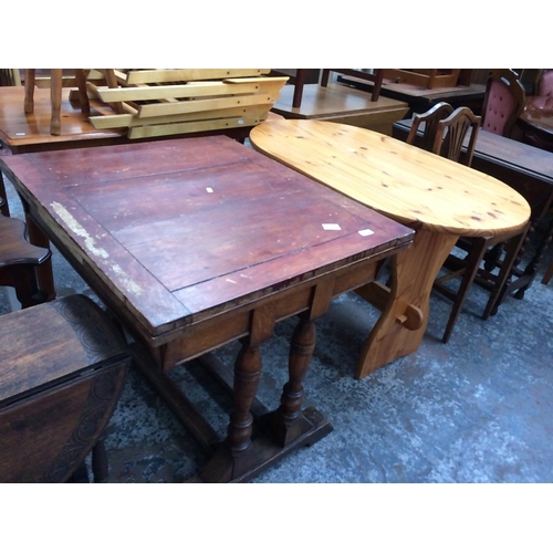 679 - TWO ITEMS: A SMALL PINE OVAL KITCHEN TABLE AND A VINTAGE OAK DINING TABLE