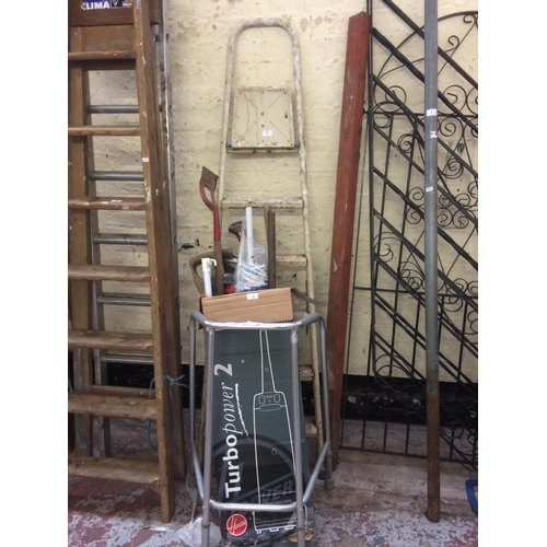 85 - A MIXED LOT TO INCLUDE SIX STEP METAL STEP LADDERS, WALKING AID AND A BOX CONTAINING GOLF CLUBS, GAR... 