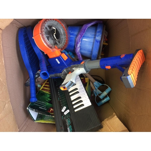 325 - A BOX CONTAINING MIXED TOYS TO INCLUDE KEYBOARD W/O, NERF GUN ETC AND A RED PLASTIC SLEDGE