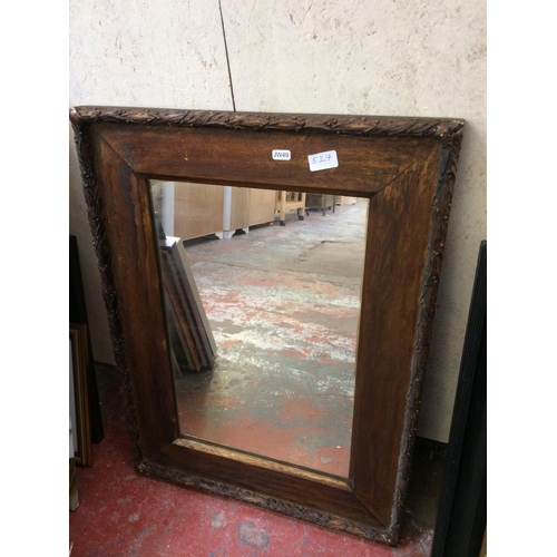 527 - A VINTAGE OAK FRAMED MIRROR AND A BLACK FRAMED OIL ON CANVAS