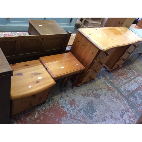 583 - THREE ITEMS: A PINE DRESSING TABLE WITH EIGHT DRAWERS, PINE NEST OF THREE TABLES AND A SMALL PINE CH... 