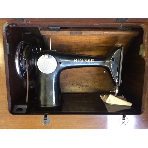 584 - A CASED VINTAGE SINGER SEWING MACHINE