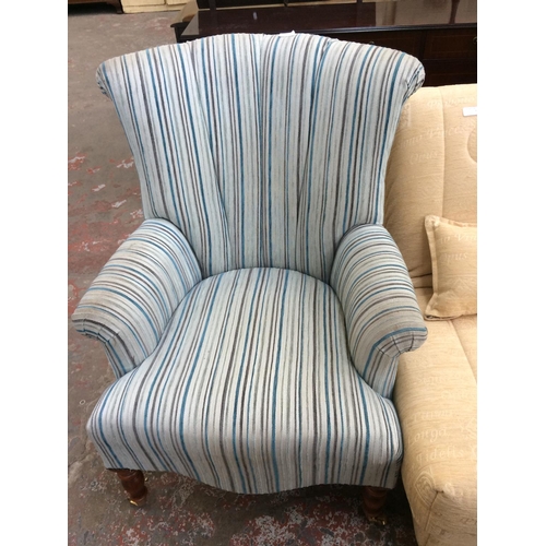 650 - A BLUE STRIPED OCCASIONAL CHAIR