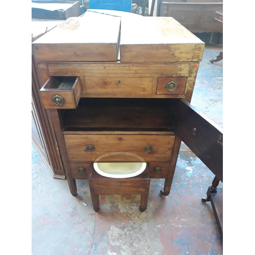 1126 - A REGENCY MAHOGANY CAMPAIGN CHEST WITH LOWER COMMODE, TWO DRAWERS AND CONCEALED TOILET MIRROR