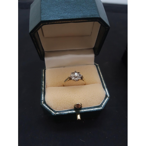 1099 - AN 18ct GOLD LADIES RING WITH NINE INSET DIAMONDS - SIZE L