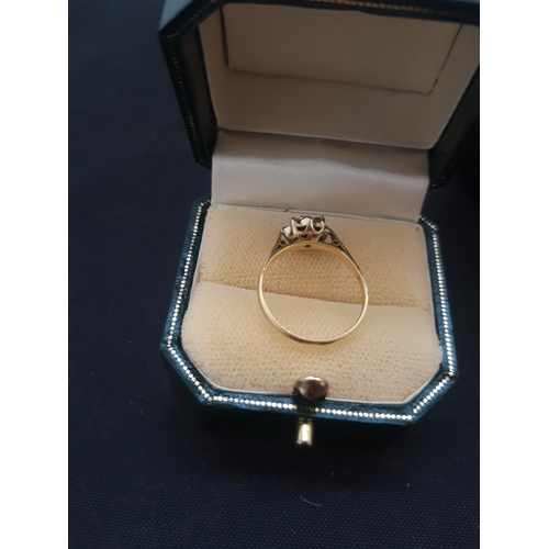 1099 - AN 18ct GOLD LADIES RING WITH NINE INSET DIAMONDS - SIZE L