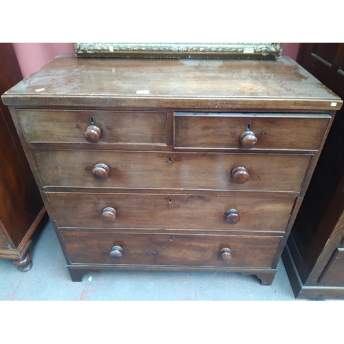 1114 - A VICTORIAN MAHOGANY CHEST OF TWO SHORT AND THREE LONG DRAWERS ON BRACKET FEET