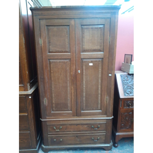 1116 - AN EARLY 20th CENTURY INLAID OAK WARDROBE WITH TWO LONG DRAWERS