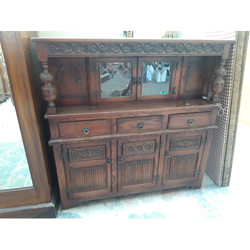 1119 - AN ANTIQUE STYLE TIGER OAK COURT CUPBOARD WITH THREE LOWER DOORS, THREE DRAWERS AND TWO UPPER GLAZED... 