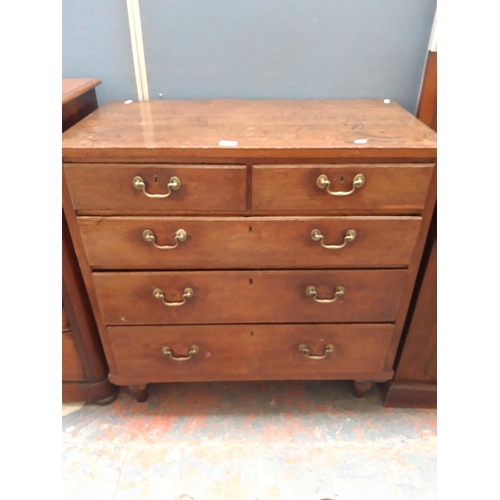 1122 - A GEORGIAN OAK CHEST OF TWO SHORT AND THREE LONG DRAWERS WITH BRASS SWAN NECK HANDLES