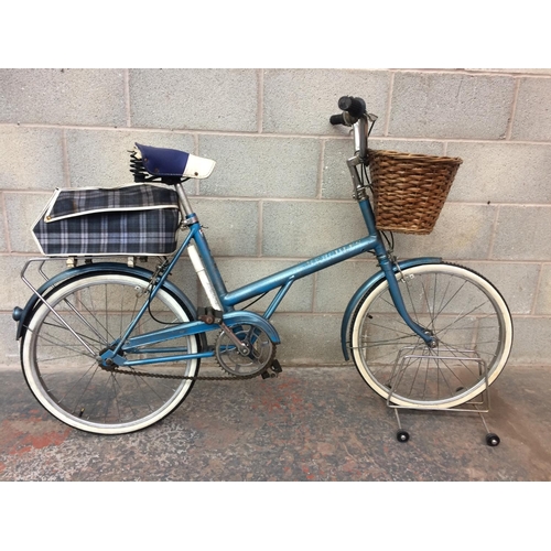 A BLUE VINTAGE HERCULES HUNTER LADIES SHOPPING BIKE WITH FRONT WICKER BASKET BROOK SADDLE AND REAR